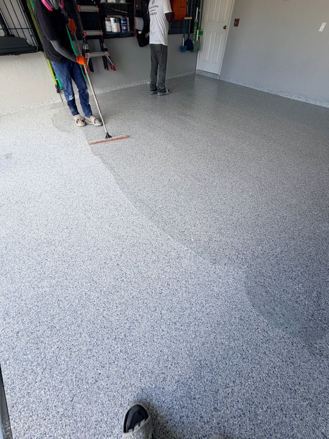 Garage floor epoxy coating in progress