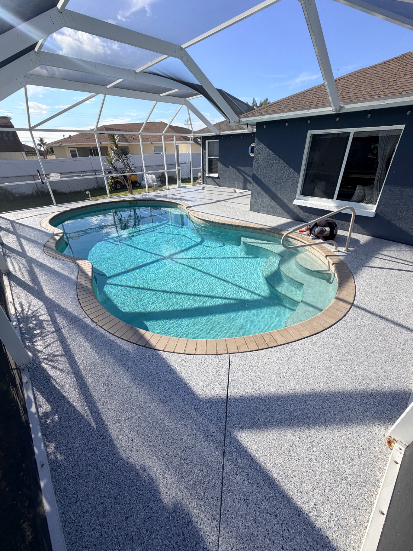 Full pool deck epoxy coating with screen enclosure