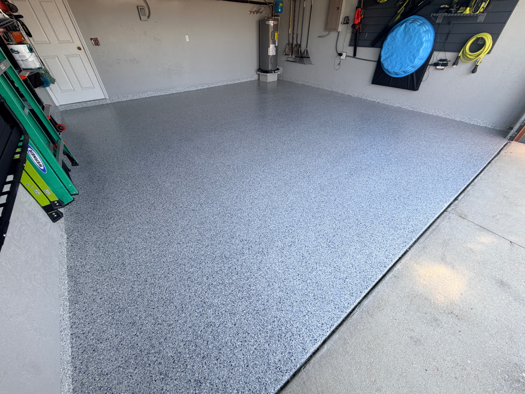 Finished garage epoxy floor with cove base