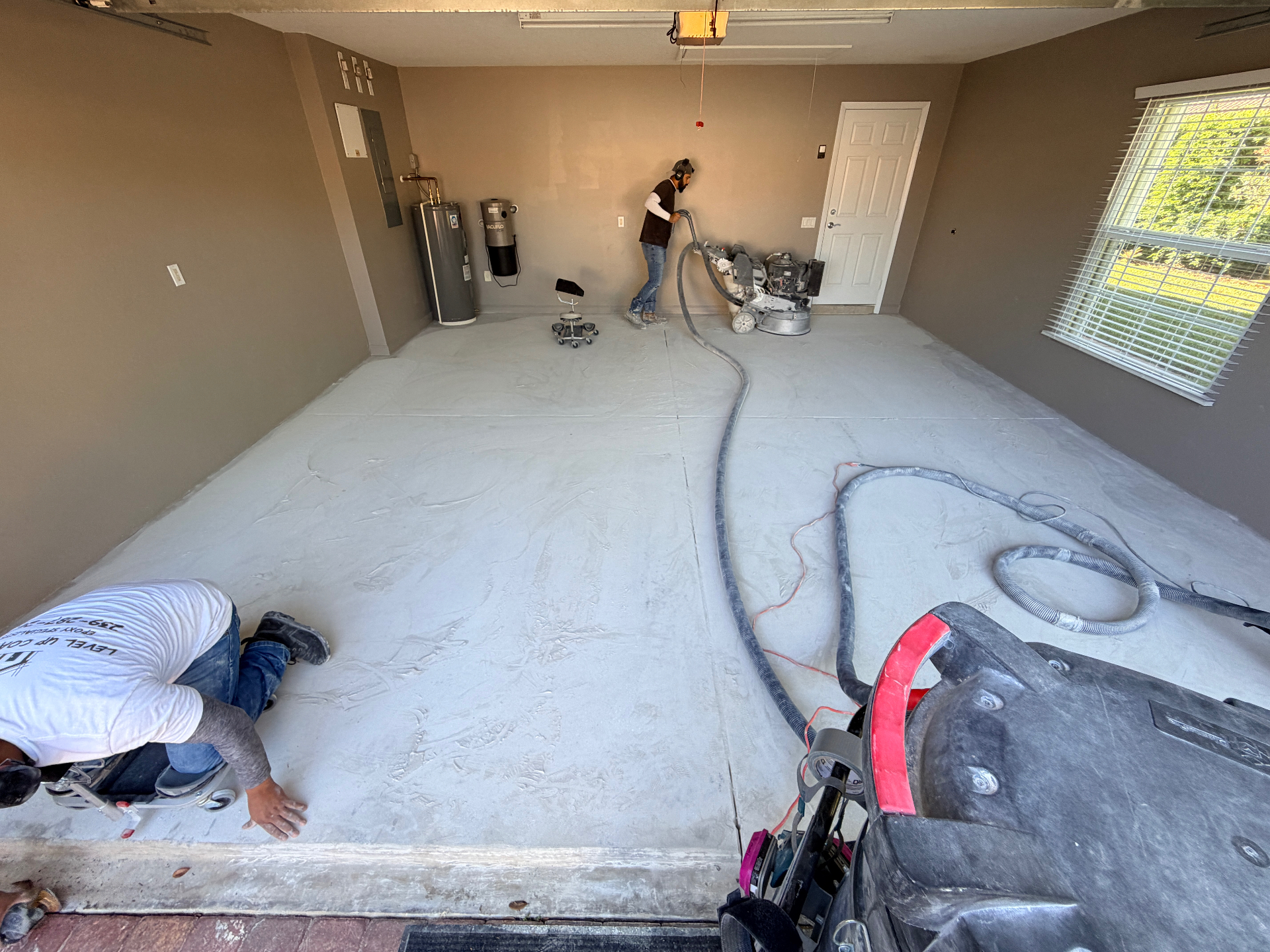 Garage floor priming and prep in progress