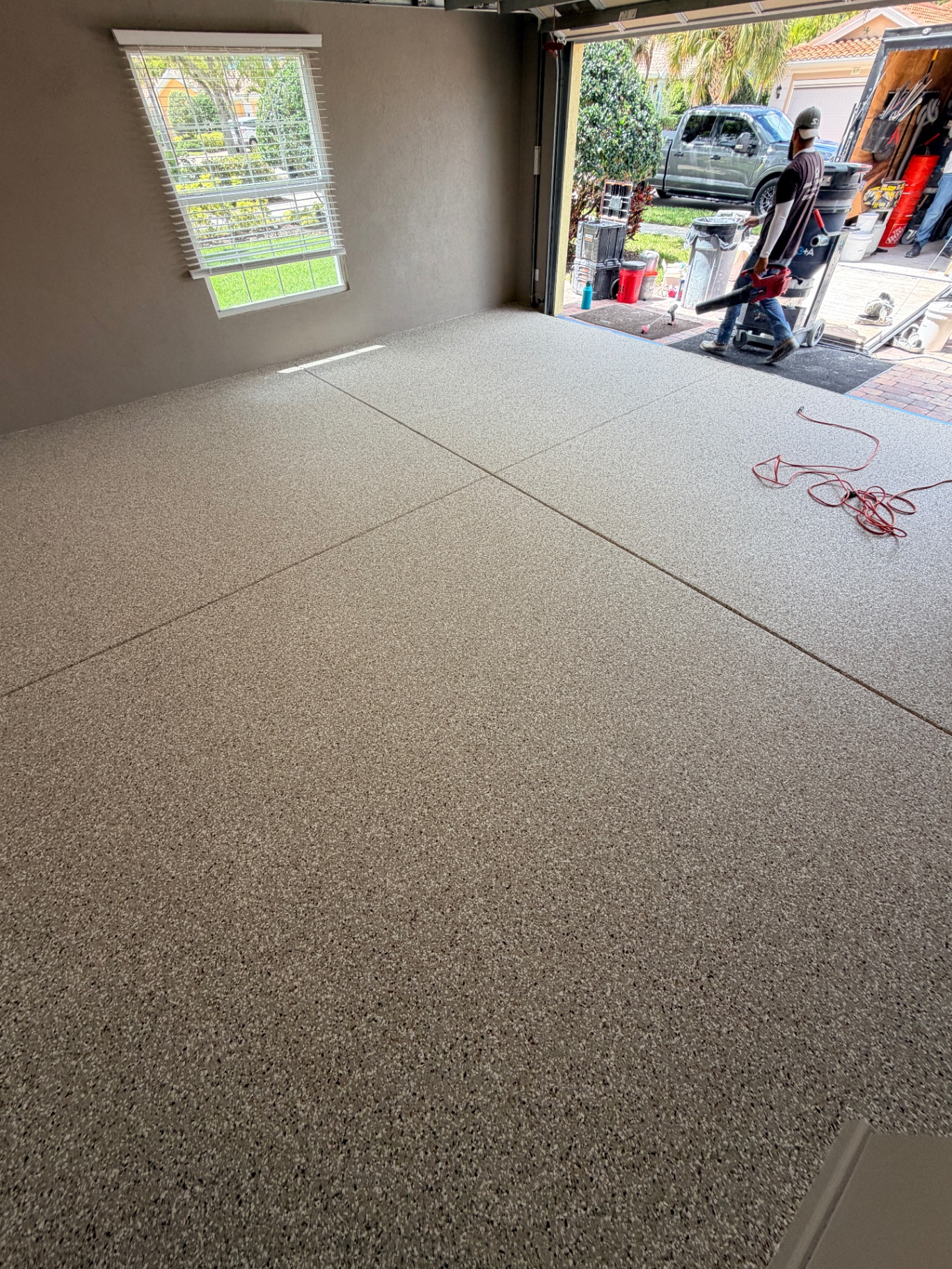 Completed garage floor coating in tan flake blend