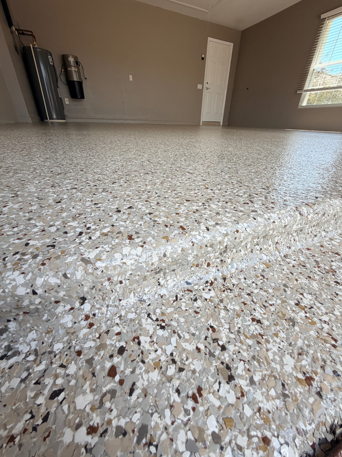 Garage floor coating close-up with decorative flake