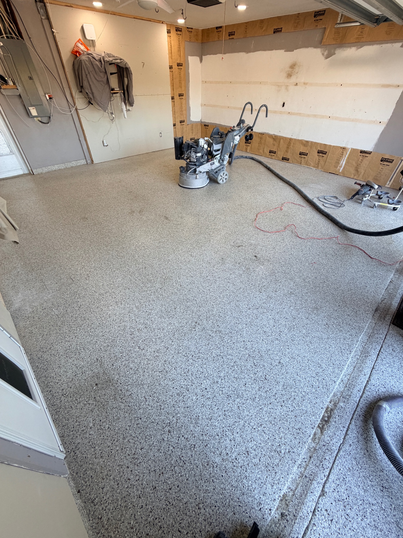 Garage coating project with grinder setup