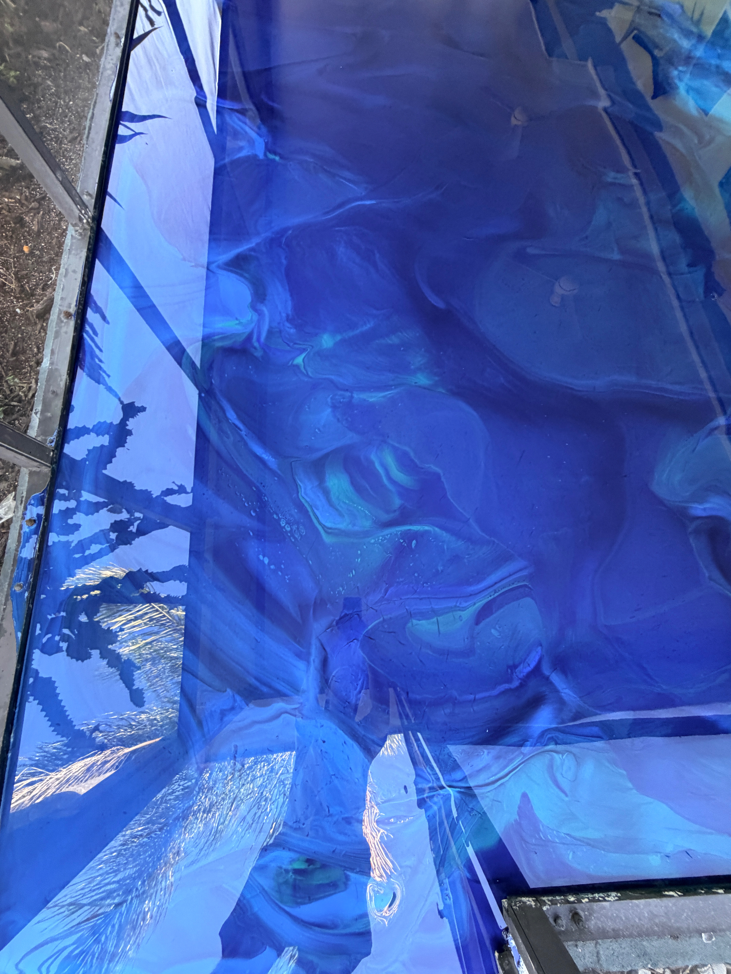 Blue metallic epoxy floor close-up detail