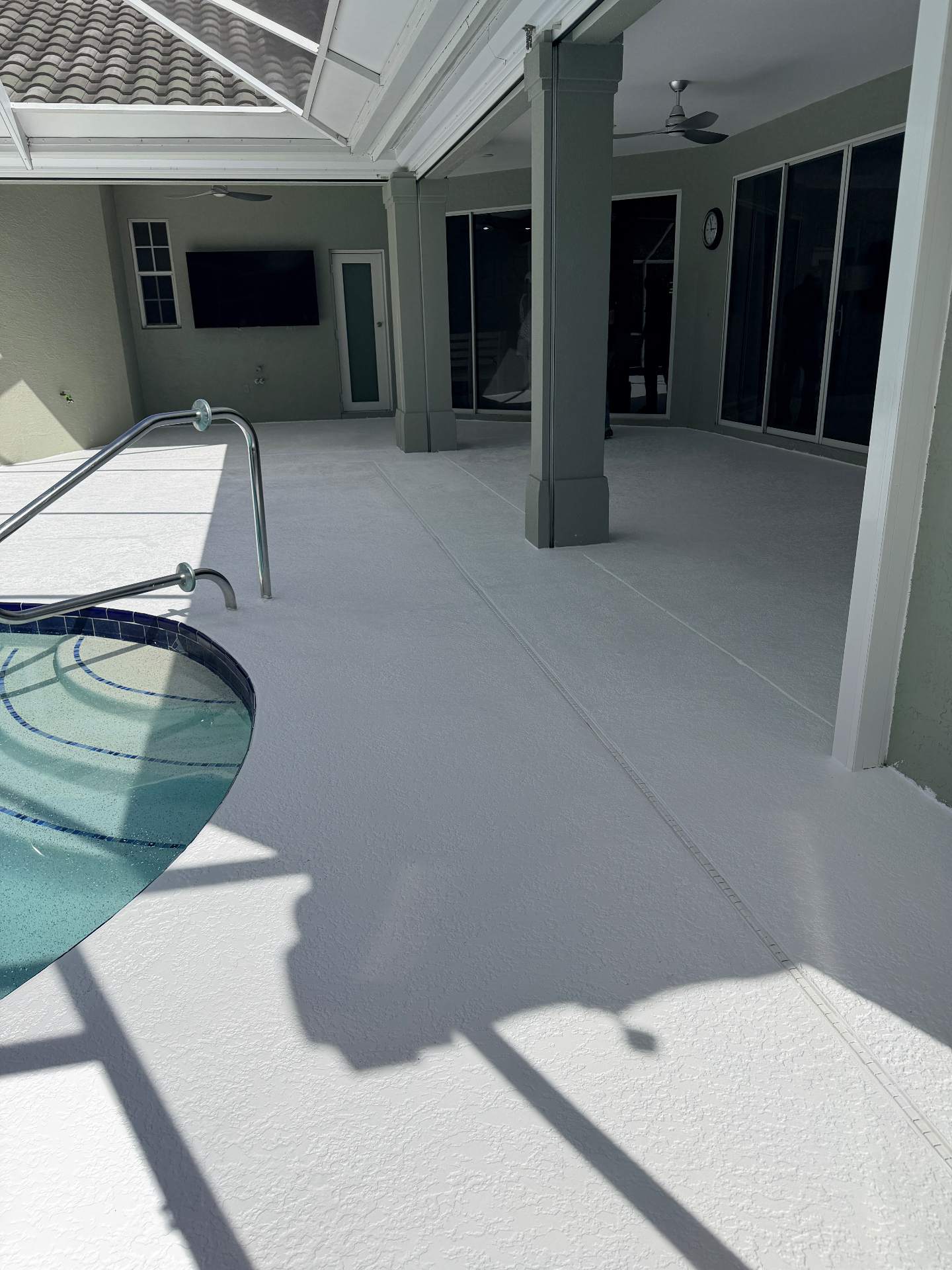 Finished pool deck and lanai epoxy coating with covered patio
